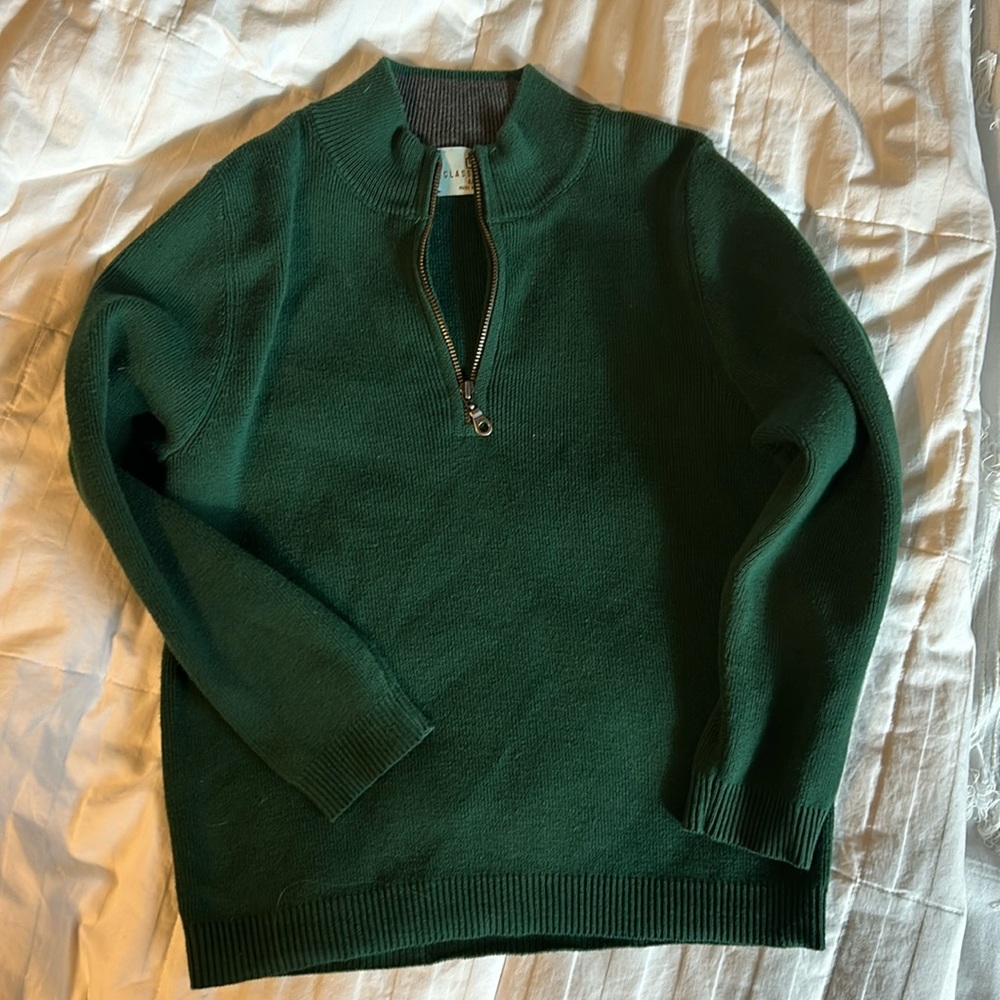 Green pullover, half zip.
